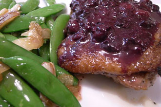 Duck Roast with blueberry sauce, and snap peas