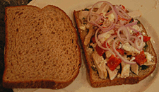 sandwich topped with fresh shallots